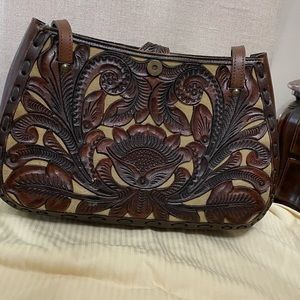 Handbag and with matching wallet. Both are new without tags.